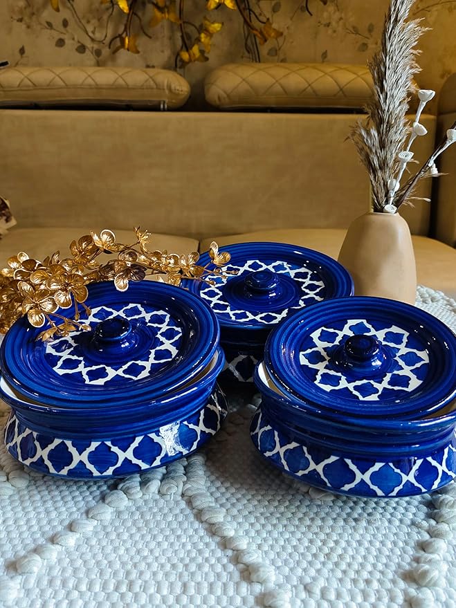 Close-up view of a yellow ceramic storage jar with lid, showcasing detailed craftsmanship.